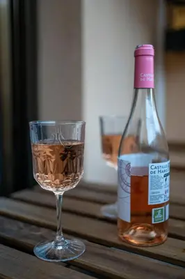 a bottle of wine and a glass on a table at Orange crush Barcelona in Barcelona