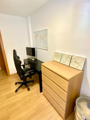 an office with a desk with a computer and a chair at Coast apartment near Barcelona in Sant Andreu de Llavaneres