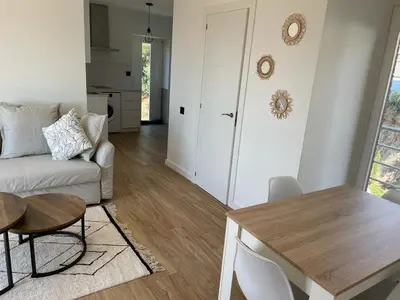 a living room with a couch and a table at Apartamento entre mar y montaña in Arenys de Munt