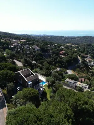 an aerial view of a house in the trees at Apartamento entre mar y montaña in Arenys de Munt