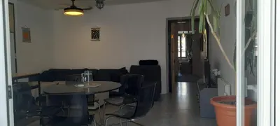 a living room with a table and chairs and a couch at Mediterranien Terrace in Calella
