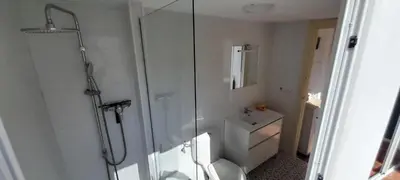 a bathroom with a shower and a toilet and a sink at Mediterranien Terrace in Calella
