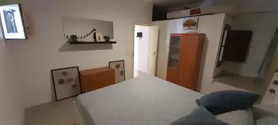 a living room with a bed and a room with aventory at Mediterranien Terrace in Calella
