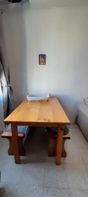 a wooden table with a laptop on top of it at Mediterranien Terrace in Calella