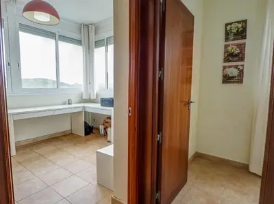 an empty room with a door and a window at Villa Papallona by Hello Homes Sitges in Sant Pere de Ribes