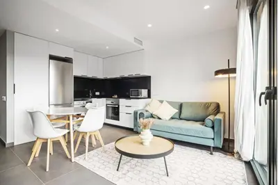 a living room with a couch and a table at CATERINA Santa Mònica in Barcelona
