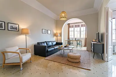 a living room with a couch and a table at Habitat Apartments Bailén in Barcelona