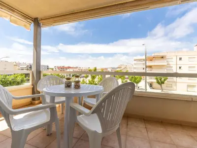 a white table and chairs on a balcony with a view at Apartment Girona by Interhome in Cubelles
