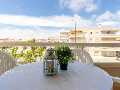 a glass lantern sitting on a table on a balcony at Apartment Girona by Interhome in Cubelles