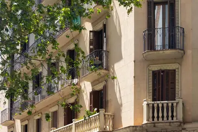 an apartment building with balconies and windows at ApartEasy - Central Barcelona Studio Apartment in Barcelona