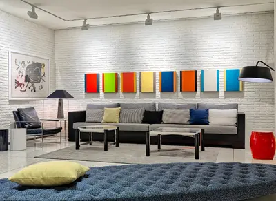 a living room with a couch and a colorful wall at H10 Art Gallery 4* Sup in Barcelona