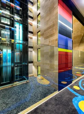 a colorful glass wall in a building at H10 Art Gallery 4* Sup in Barcelona