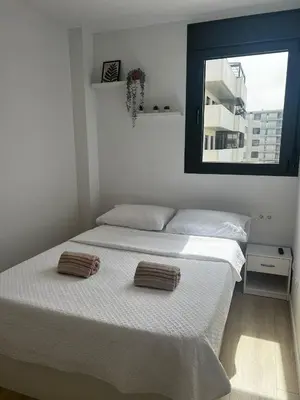 a bedroom with a bed with two pillows on it at Confortable habitación doble - 2 in Sant Adria de Besos
