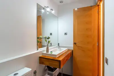 a bathroom with a sink and a mirror at 1520 - AB Eixample Sicília Apartment in Barcelona