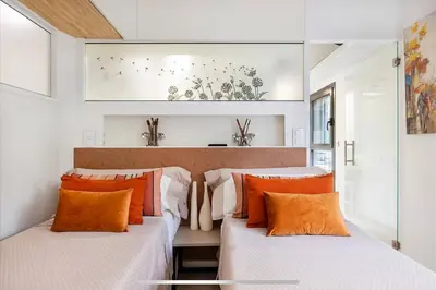 a kitchen with white cabinets and a counter top at II-II Hub Luxury New Apartments in Barcelona