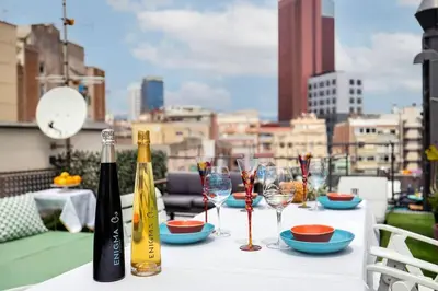 a white table and chairs on a balcony at II-II Hub Luxury New Apartments in Barcelona