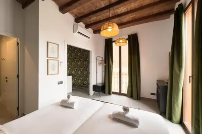 a bedroom with a bed with two towels on it at Bebarceloner Poble Nou Apartments - 1 bedroom in Barcelona