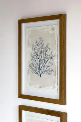 a framed painting of a tree on a wall at Bebarceloner Poble Nou Apartments - 1 bedroom in Barcelona