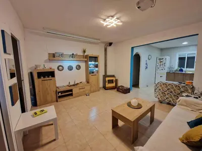 a living room with a couch and a table at Le Petit Paradis Olivella in Olivella