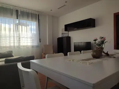 a white table and chairs in a living room at Ap4Us B1 - Apartment for us - Sightseeing & Beach near to Barcelona in Badalona
