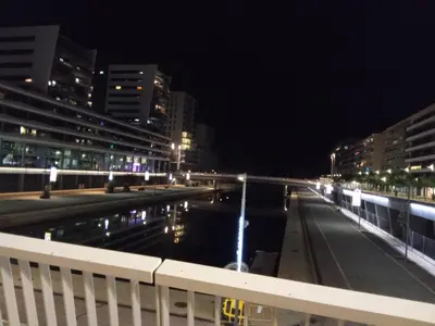 a city street at night with a body of water at Ap4Us B1 - Apartment for us - Sightseeing & Beach near to Barcelona in Badalona