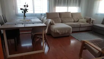 a living room with a couch and a table at Ap4Us B1 - Apartment for us - Sightseeing & Beach near to Barcelona in Badalona