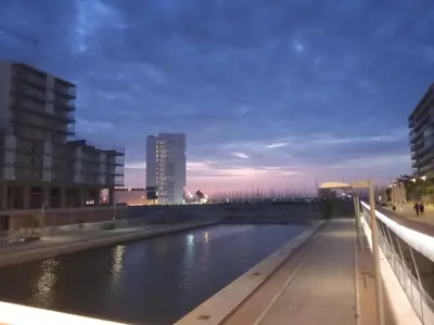 a view of a river in a city at night at Ap4Us B1 - Apartment for us - Sightseeing & Beach near to Barcelona in Badalona