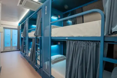 a group of bunk beds in a room at Malacuna Barcelona in Barcelona