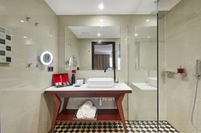 a bathroom with a sink and a shower at Hotel Cortes Rambla in Barcelona