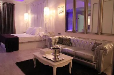 a living room with a couch and a bed at Romantic Barcelona Apartment in Barcelona