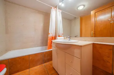 a bathroom with a sink and a bath tub at HomeHolidaysRentals Fortuny - Costa Barcelona in Pineda de Mar