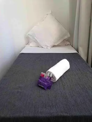 a close up of a bed with a towel on it at Hostal Argo in Barcelona