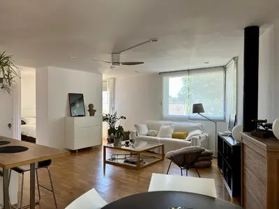 a living room with a couch and a table at Loft Bouquet Alella mar y montaña 25 min a BCN in Alella
