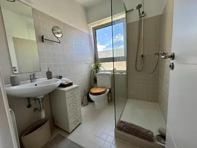 a bathroom with a toilet and a sink and a shower at Loft Bouquet Alella mar y montaña 25 min a BCN in Alella