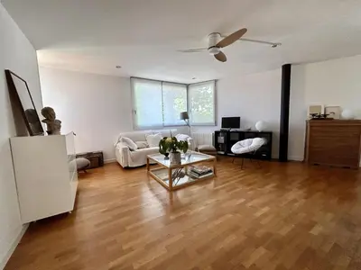 a living room with a couch and a table at Loft Bouquet Alella mar y montaña 25 min a BCN in Alella