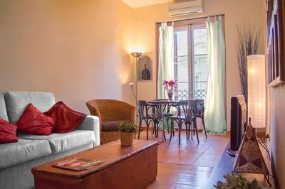 a living room with a couch and a table at Gaudi Apartment 9 in Barcelona
