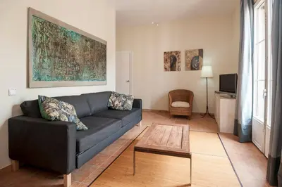 a living room with a couch and a table at Gaudi Apartment 9 in Barcelona
