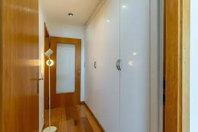 a room with a hallway with a door and a mirror at AB Olympic Village III Penthouse in Barcelona