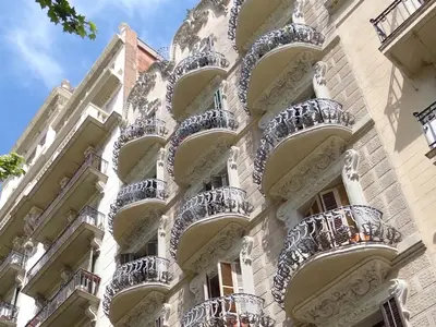 an apartment building with balconies on the side of it at Hostal Balkonis in Barcelona