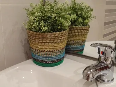 two potted plants sitting on top of a bathroom sink at Hostal Balkonis in Barcelona