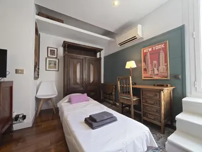 a bedroom with a bed and a desk in it at Apolo RoofTop Barcelona in Barcelona