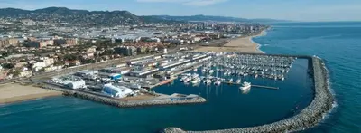 an aerial view of a harbor with boats in the water at Precioso Dúplex con terraza a 5 minutos playa y 20 minutos de Barcelona in Premiá de Mar