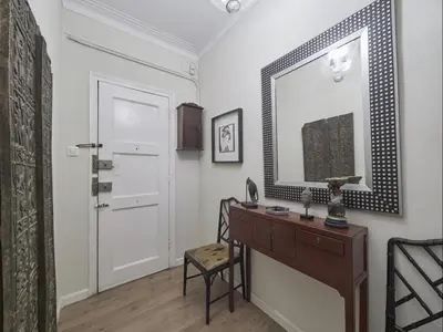 a room with a desk and a mirror and a door at Casa Sagrada Familia in Barcelona