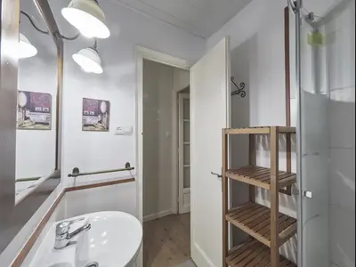 a bathroom with a sink and a mirror at Casa Sagrada Familia in Barcelona
