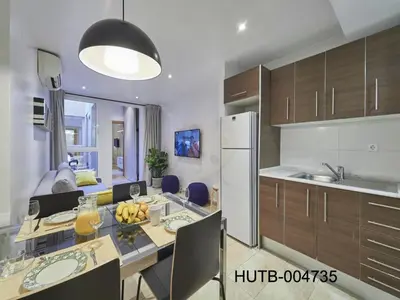 a kitchen with a table with bananas on it at Duplex Sagrada Familia 2 in Barcelona