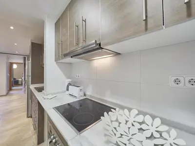 a kitchen with a sink and a counter top at Duplex Sagrada Familia 2 in Barcelona