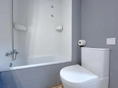 a bathroom with a toilet and a bath tub at Vivalidays Vianka - Pineda de Mar in Pineda de Mar