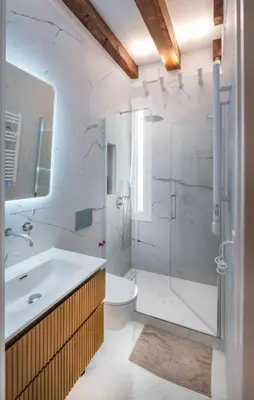a bathroom with a shower and a sink and a toilet at Ramblas Waterfront Stay in Barcelona