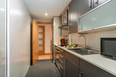 a kitchen with a sink and a counter top at AB San Mariano - Park Guell in Barcelona