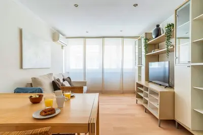 a small bedroom with a bed and a window at AB San Mariano - Park Guell in Barcelona